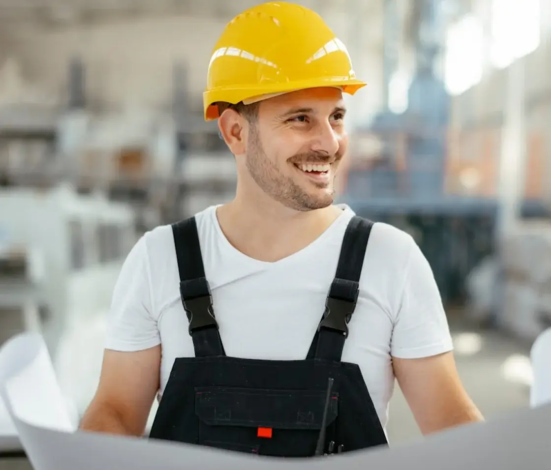 Amazon RME professional reviewing plans on the factory floor